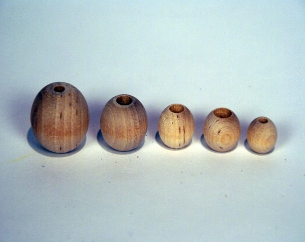 Unfinished wooden beads in various sizes, available in bulk for manufacturers and high-volume production runs.